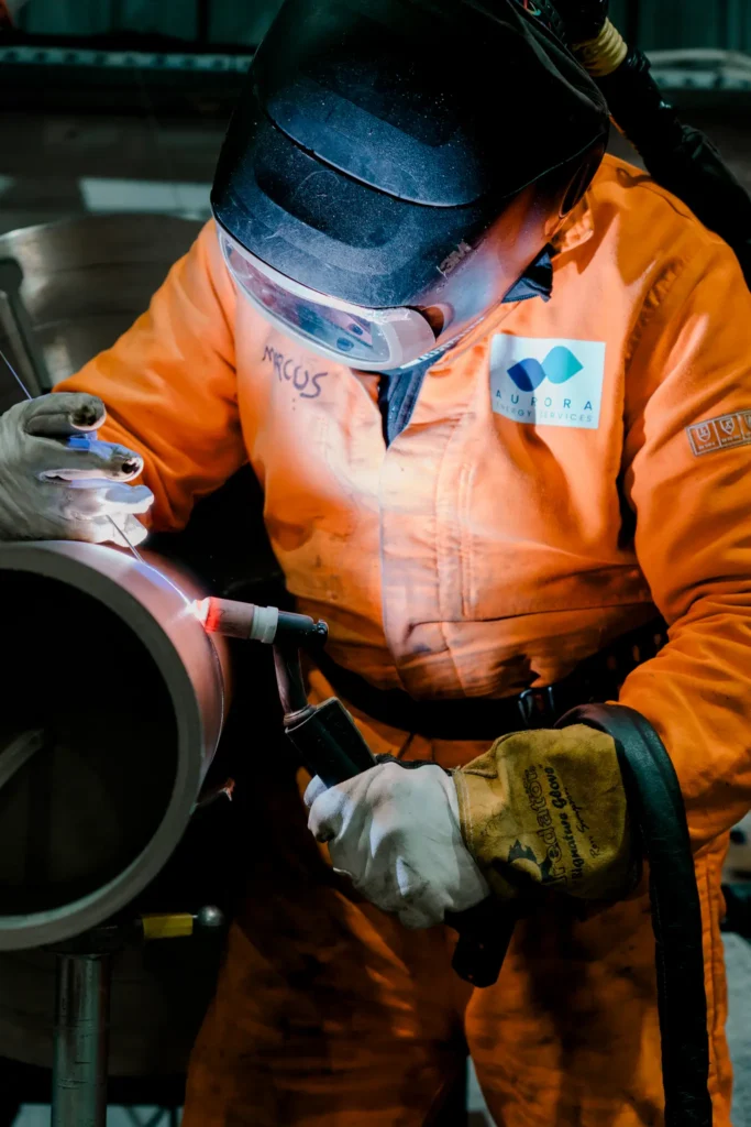 An Aurora Energy Services welder fabricating a pipe spool